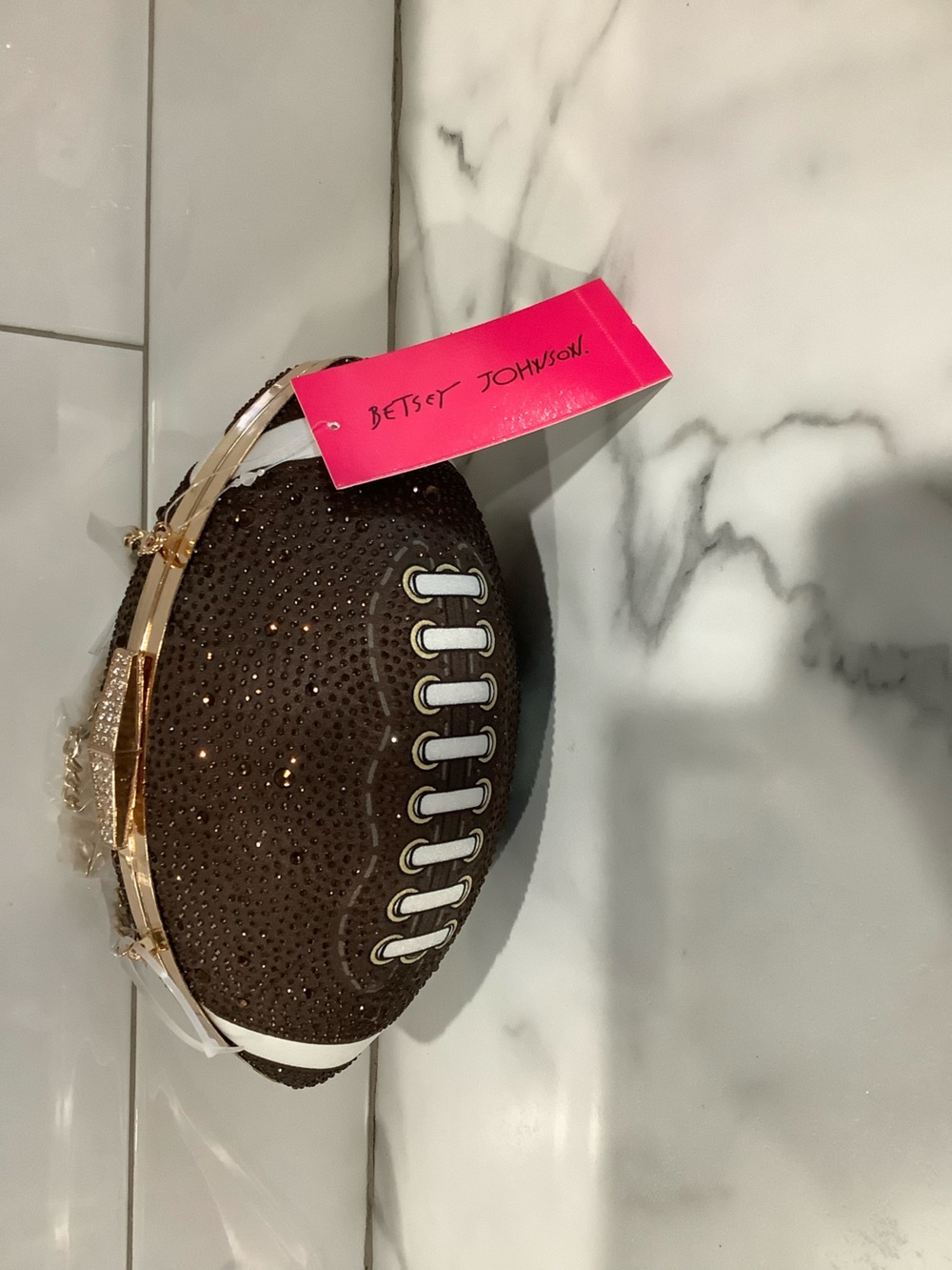 Gorgeous crystal football with crossbody chain.